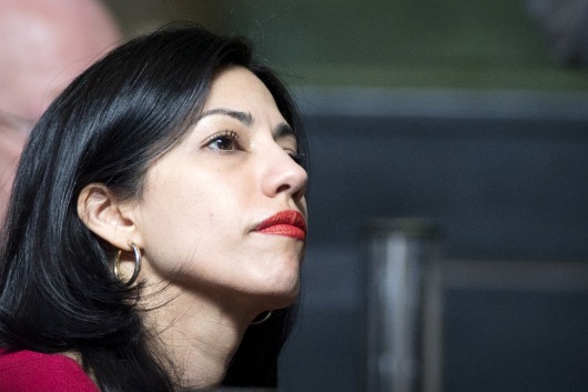 Huma Abedin listens during speech by democratic presidential candidate Hillary Clinton at the 18th Annual David N. Dinkins Leadership and Public Policy Forum at Columbia University in New York